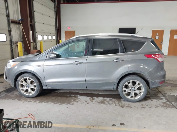 2014 Ford Escape Titanium with VIN 1FMCU9J90EUC31625, listed as a IAAI auction lot 41492075 with 301,917 mi miles and . Bid and sale history available at DreamBid. Image 14.