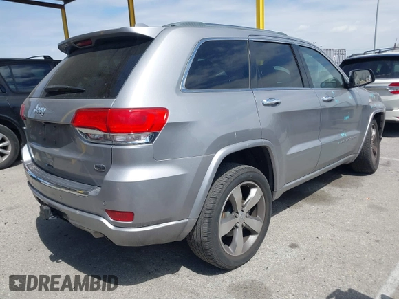 2014 Jeep Grand Cherokee Overland with VIN 1C4RJECG0EC291048, listed as a IAAI auction lot 41883941 with 81,871 mi miles. Bid and sale history available at carsss.com. Image 4.