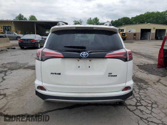 2018 Toyota RAV4 Hybrid SE with VIN JTMJJREV1JD172042, listed as a Copart auction lot 61418305 with 143,902 mi miles and Salvage title. Bid and sale history available at DreamBid. Image 6.