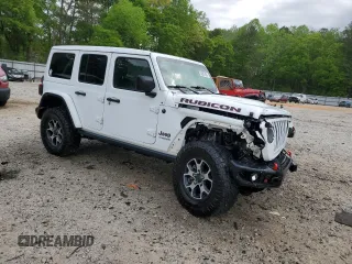 2018 Jeep Wrangler Unlimited Rubicon with VIN 1C4HJXFG2JW244664, listed as a Copart auction lot 52987455 with 40,463 mi miles and Salvage title. Bid and sale history available at DreamBid. Image 4.