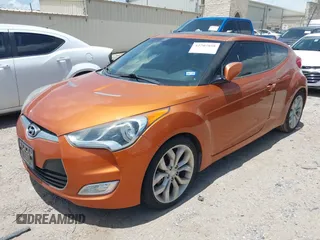 2013 Hyundai Veloster w/Black Int with VIN KMHTC6AD0DU147017, listed as a IAAI auction lot 42707858 with 115,130 mi miles and . Bid and sale history available at DreamBid. Image 2.