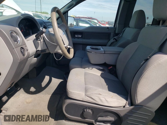 2007 Ford F-150 STX with VIN 1FTRX12W57FB31037, listed as a Copart auction lot 50779865 with 262,572 mi miles and Salvage Title. Bid and sale history available at DreamBid. Image 7.