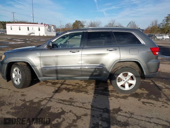 2011 Jeep Grand Cherokee 70th Anniversary with VIN 1J4RR4GT6BC715848, listed as a IAAI auction lot 41562152 with 119,910 mi miles. Bid and sale history available at carsss.com. Image 14.