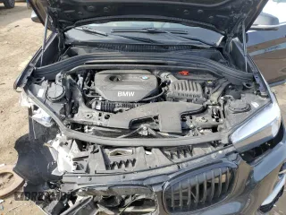2018 BMW X1 xDrive28i with VIN WBXHT3C31J5K25021, listed as a Copart auction lot 48779555 with 71,741 mi miles and Salvage Title. Bid and sale history available at carsss.com. Image 12.