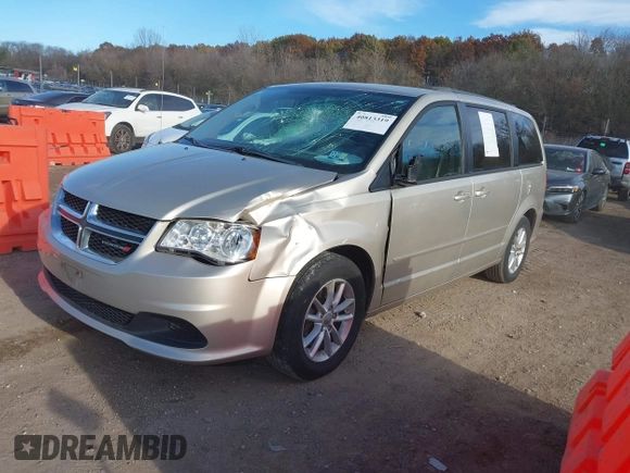 2014 Dodge Grand Caravan SXT with VIN 2C4RDGCG0ER210186, listed as a IAAI auction lot 40813319 with 100,230 mi miles and . Bid and sale history available at DreamBid. Image 2.