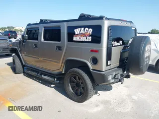 2003 Hummer H2 with VIN 5GRGN23U43H125114, listed as a IAAI auction lot 42160986 with 157,776 mi miles. Bid and sale history available at carsss.com. Image 3.