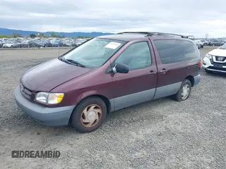 1999 Toyota Sienna LE with VIN 4T3ZF13C7XU152879, listed as a IAAI auction lot 41974953 with 201,644 mi miles. Bid and sale history available at carsss.com. Image 2.