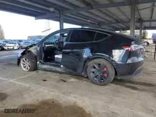2023 Tesla Model Y Long Range with VIN 7SAYGDEE3PF938230, listed as a Copart auction lot 47883385 with 28,461 mi miles and Salvage Title. Bid and sale history available at carsss.com. Image 2.
