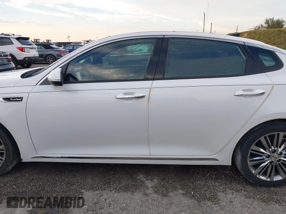 2018 Kia Optima SX with VIN 5XXGV4L21JG182103, listed as a IAAI auction lot 40522762 with 60,542 mi miles and . Bid and sale history available at DreamBid. Image 14.