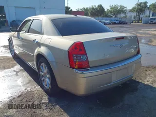 2009 Chrysler 300 Limited with VIN 2C3KA33V99H592963, listed as a IAAI auction lot 42041417 with 160,829 mi miles. Bid and sale history available at carsss.com. Image 3.