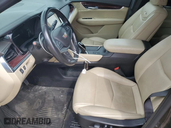 2019 Cadillac XT5 Luxury FWD with VIN 1GYKNCRSXKZ132871, listed as a Copart auction lot 54879405 with 57,325 mi miles and Salvage title. Bid and sale history available at DreamBid. Image 7.