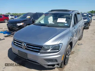 2021 Volkswagen Tiguan SE with VIN 3VV3B7AX0MM026064, listed as a IAAI auction lot 42038137 with 18,526 mi miles and . Bid and sale history available at DreamBid. Image 2.