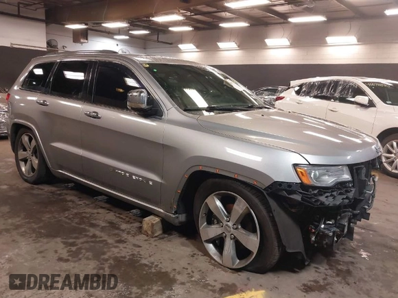 2015 Jeep Grand Cherokee Overland with VIN 1C4RJFCG1FC215426, listed as a IAAI auction lot 41689821 with 128,563 mi miles. Bid and sale history available at carsss.com. Image 1.