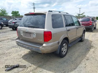 2004 Honda Pilot EX with VIN 2HKYF18434H575250, listed as a IAAI auction lot 42219882 with 196,515 mi miles and . Bid and sale history available at carsss.com. Image 4.