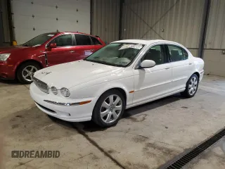 2004 Jaguar X-Type with VIN SAJEA51C34WE06046, listed as a Copart auction lot 56982105 with 69,265 mi miles and Clean Title. Bid and sale history available at DreamBid. Image 1.