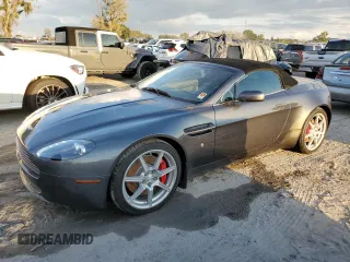 2008 Aston Martin Vantage z VIN SCFBB04B88GD08555, wystawiony jako Copart lot #73878724 z przebiegiem Nie podano mil oraz Szkoda całkowita • Salvage title. Historia ofert i sprzedaży dostępna na DreamBid. Obrazek 1.