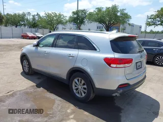 2016 Kia Sorento LX with VIN 5XYPG4A54GG009459, listed as a IAAI auction lot 42113972 with 158,950 mi miles. Bid and sale history available at carsss.com. Image 3.