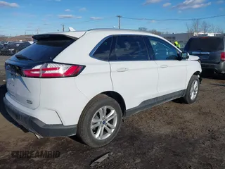 2019 Ford Edge SEL z VIN 2FMPK4J94KBB99418, wystawiony jako IAAI lot #41294393 z przebiegiem 57 706 mil mil oraz . Historia ofert i sprzedaży dostępna na DreamBid. Obrazek 4.
