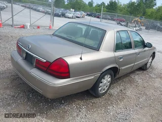 2005 Mercury Grand Marquis LS Premium with VIN 2MEFM75W35X654244, listed as a IAAI auction lot 42090783 with 120,033 mi miles. Bid and sale history available at carsss.com. Image 4.