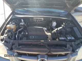 2006 Mazda Tribute S with VIN 4F2YZ04176KM19634, listed as a Copart auction lot 46796315 with 276,632 mi miles and Salvage Title. Bid and sale history available at DreamBid. Image 12.