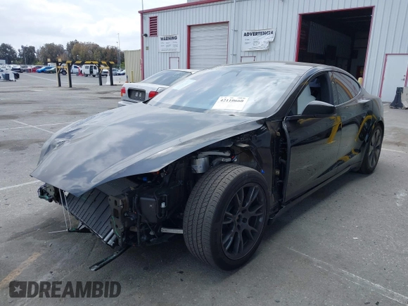 2023 Tesla Model S with VIN 5YJSA1E52PF528795, listed as a IAAI auction lot 42110660 with 21,243 mi miles and . Bid and sale history available at DreamBid. Image 17.