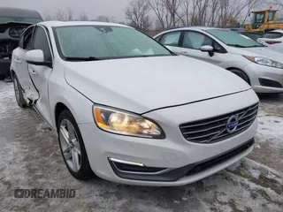 2015 Volvo S60 T5 Drive-E Premier with VIN YV140MFK3F1351631, listed as a IAAI auction lot 41558911 with 144,457 mi miles. Bid and sale history available at carsss.com. Image 1.