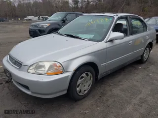 1997 Honda Civic EX with VIN 2HGEJ8643VH561244, listed as a IAAI auction lot 41810988 with 130,000 mi miles. Bid and sale history available at carsss.com. Image 2.