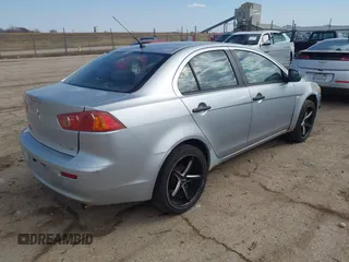 2009 Mitsubishi Lancer DE with VIN JA3AU16U79U007847, listed as a IAAI auction lot 41749150 with 155,795 mi miles. Bid and sale history available at carsss.com. Image 4.