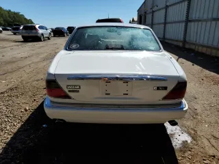 1996 Jaguar XJ with VIN SAJHX1747TC767829, listed as a Copart auction lot 76677444 with Not provided miles and Salvage title. Bid and sale history available at DreamBid. Image 6.