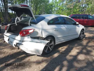 2012 Volkswagen CC Sport PZEV with VIN WVWMP7AN5CE543495, listed as a IAAI auction lot 42150948 with 100,984 mi miles. Bid and sale history available at carsss.com. Image 4.