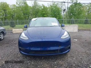 2023 Tesla Model Y Long Range z VIN 7SAYGDEE6PF603981, wystawiony jako IAAI lot #42133348 z przebiegiem 28 566 mil mil oraz . Historia ofert i sprzedaży dostępna na DreamBid. Obrazek 13.