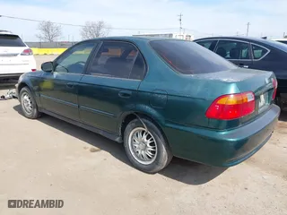 1999 Honda Civic VP with VIN 2HGEJ6619XH509582, listed as a IAAI auction lot 41774443 with 231,357 mi miles. Bid and sale history available at carsss.com. Image 3.