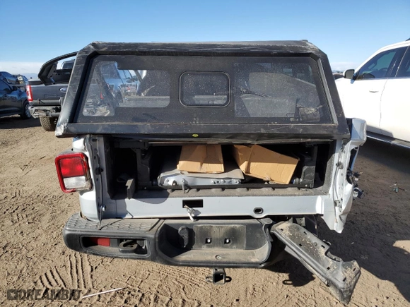 2023 Jeep Gladiator Freedom with VIN 1C6HJTAGXPL518694, listed as a Copart auction lot 86740754 with 9,460 mi miles and Salvage Title. Bid and sale history available at carsss.com. Image 6.