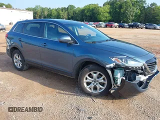 2014 Mazda CX-9 Touring with VIN JM3TB3CV7E0435659, listed as a IAAI auction lot 42428247 with 124,523 mi miles and . Bid and sale history available at DreamBid. Image 1.