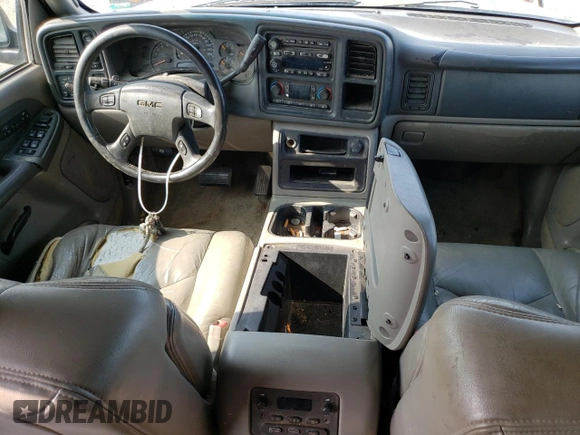 2003 GMC Yukon SLT z VIN 1GKEK13Z93J159795, wystawiony jako Copart lot #64915913 z przebiegiem 414 569 mil mil oraz Szkoda całkowita • Salvage title. Historia ofert i sprzedaży dostępna na DreamBid. Obrazek 8.