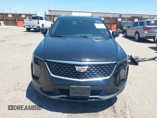 2024 Cadillac XT4 AWD Premium Luxury z VIN 1GYFZDR44RF144801, wystawiony jako IAAI lot #42646613 z przebiegiem 37 358 mil mil oraz . Historia ofert i sprzedaży dostępna na DreamBid. Obrazek 13.