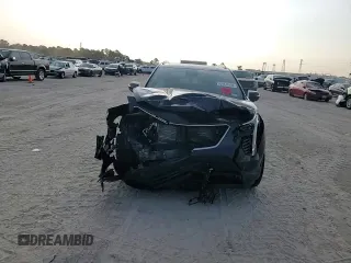 2022 Cadillac XT4 FWD Sport z VIN 1GYFZER45NF156035, wystawiony jako Copart lot #65836294 z przebiegiem 62 443 mil mil oraz Szkoda całkowita • Salvage title. Historia ofert i sprzedaży dostępna na DreamBid. Obrazek 11.