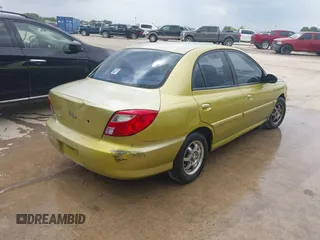 2001 Kia Rio with VIN KNADC123616048085, listed as a IAAI auction lot 42025600 with 123,493 mi miles. Bid and sale history available at carsss.com. Image 4.