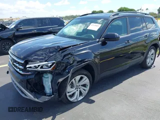 2021 Volkswagen Atlas SE with VIN 1V2WR2CA1MC607768, listed as a IAAI auction lot 42518885 with 49,286 mi miles and . Bid and sale history available at DreamBid. Image 2.