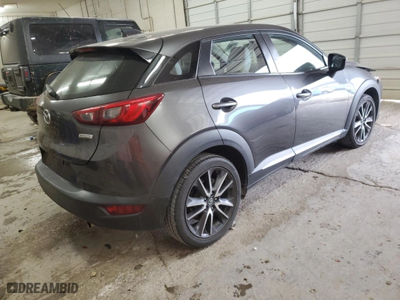 2018 Mazda CX-3 Grand Touring with VIN JM1DKFD74J0317898, listed as a Copart auction lot 41859085 with 92,216 mi miles and Salvage Title. Bid and sale history available at carsss.com. Image 3.