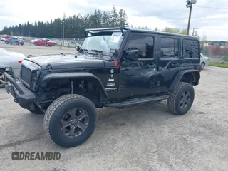 2014 Jeep Wrangler Unlimited Sahara with VIN 1C4BJWEG6EL107526, listed as a IAAI auction lot 42030244 with 69,077 mi miles. Bid and sale history available at carsss.com. Image 2.