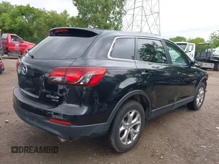 2015 Mazda CX-9 Sport with VIN JM3TB3BV1F0466070, listed as a IAAI auction lot 42350686 with 110,818 mi miles and . Bid and sale history available at DreamBid. Image 4.