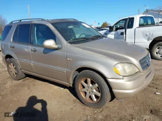 2001 Mercedes-Benz M-Class with VIN 4JGAB72E51A247926, listed as a IAAI auction lot 41277111 with 208,817 mi miles. Bid and sale history available at carsss.com. Image 1.