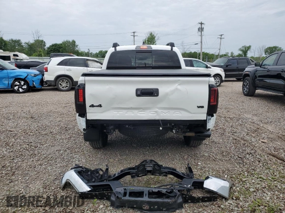 2023 Toyota Tacoma SR with VIN 3TMCZ5AN2PM642205, listed as a Copart auction lot 61045955 with 10,596 mi miles and Salvage title. Bid and sale history available at DreamBid. Image 6.
