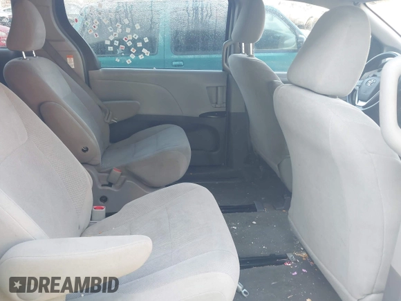 2015 Toyota Sienna L with VIN 5TDZK3DC5FS657115, listed as a IAAI auction lot 42109678 with 176,995 mi miles. Bid and sale history available at carsss.com. Image 8.