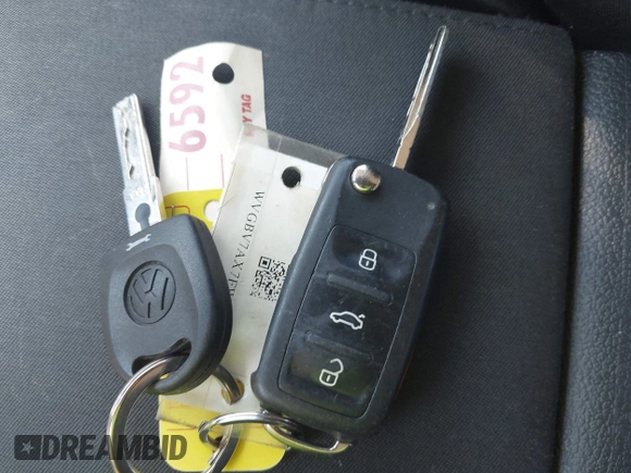 2015 Volkswagen Tiguan SE z VIN WVGBV7AX7FW056002, wystawiony jako IAAI lot #42122641 z przebiegiem 77 037 mil mil oraz . Historia ofert i sprzedaży dostępna na DreamBid. Obrazek 11.