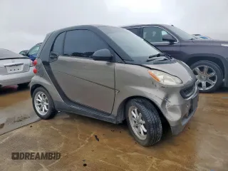 2009 Smart fortwo Pure z VIN WMEEJ31X49K233947, wystawiony jako Copart lot #60535065 z przebiegiem 48 669 mil mil oraz Czysty tytuł • Clean title. Historia ofert i sprzedaży dostępna na DreamBid. Obrazek 4.