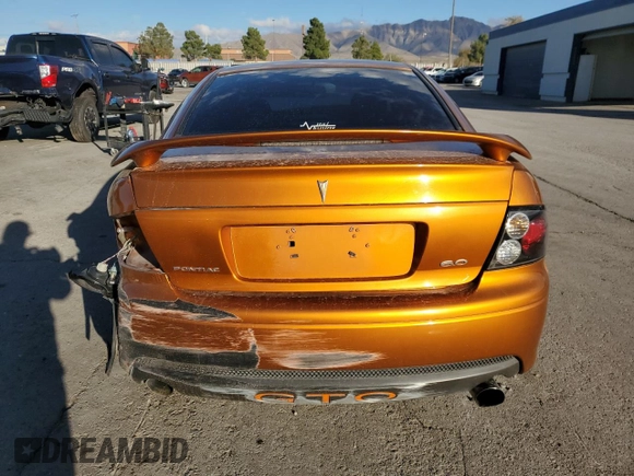2006 Pontiac GTO z VIN 6G2VX12U26L832381, wystawiony jako Copart lot #79539604 z przebiegiem 116 157 mil mil oraz Szkoda całkowita • Salvage title. Historia ofert i sprzedaży dostępna na DreamBid. Obrazek 6.