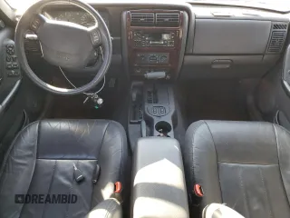 2001 Jeep Cherokee Sport z VIN 1J4FF58S61L612533, wystawiony jako Copart lot #76824714 z przebiegiem 62 401 mil mil oraz Szkoda całkowita • Salvage title. Historia ofert i sprzedaży dostępna na DreamBid. Obrazek 8.