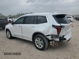 2024 Cadillac XT6 FWD Luxury with VIN 1GYKPAR47RZ720446, listed as a Copart auction lot 51762695 with 10,728 mi miles and Salvage Title. Bid and sale history available at carsss.com. Image 2.